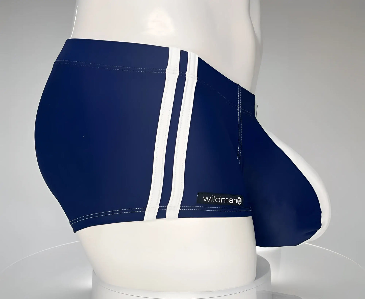 WildmanT monster cock swim square cut navy swim trunks with white side stripes and wildman brand label
