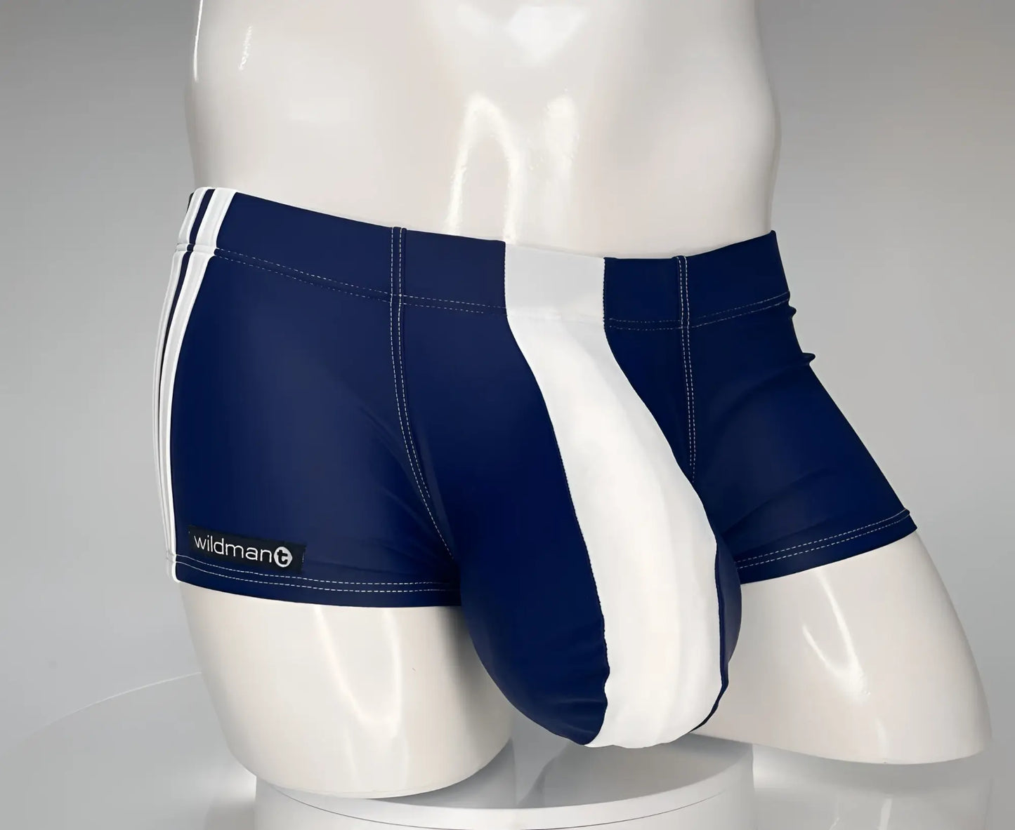WildmanT monster cock swim square cut navy and white athletic swim trunks with sleek form fitting design and side stripes