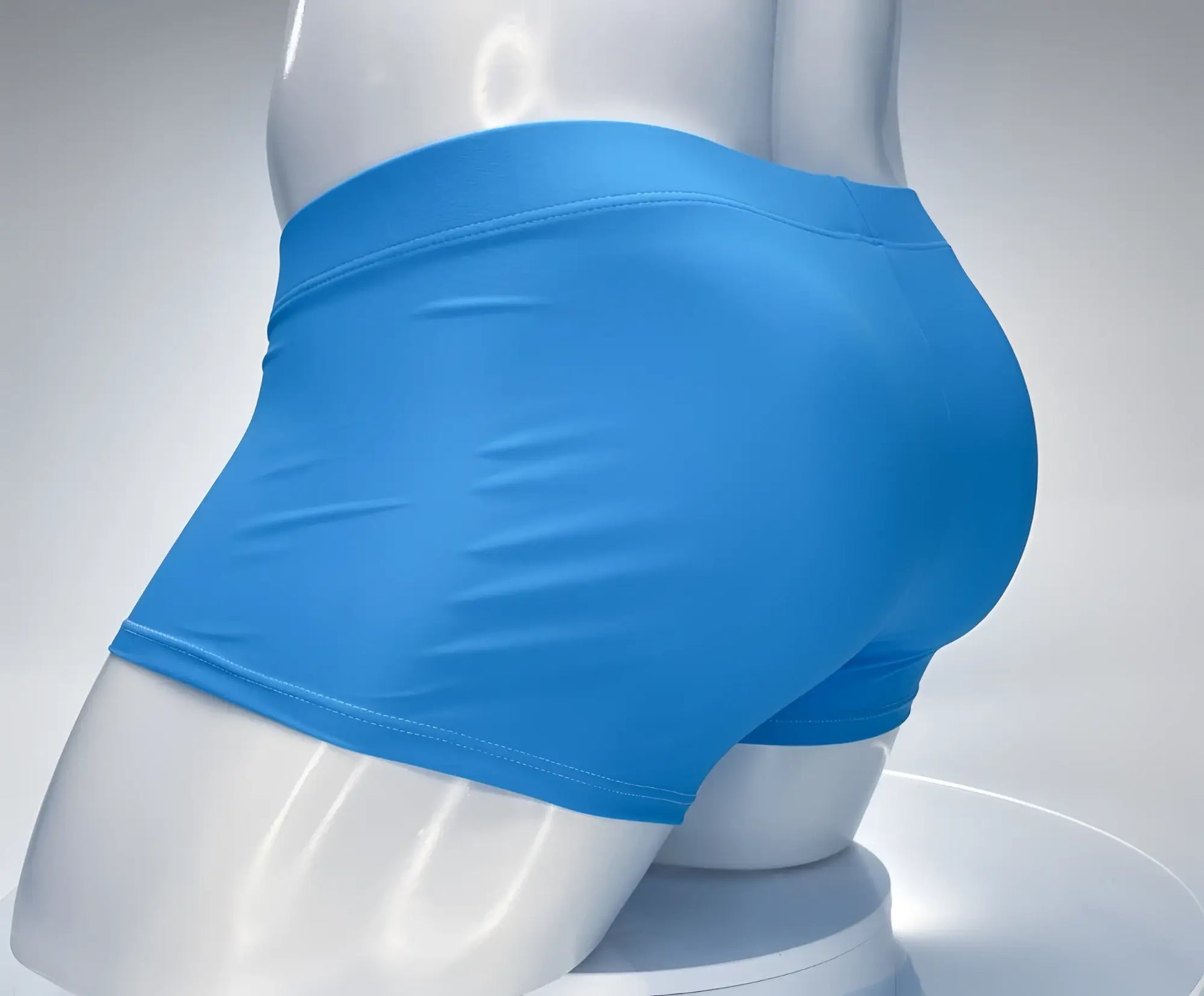 Bright blue form-fitting athletic shorts on mannequin from wildmant monster cock swim square cut teal white collection