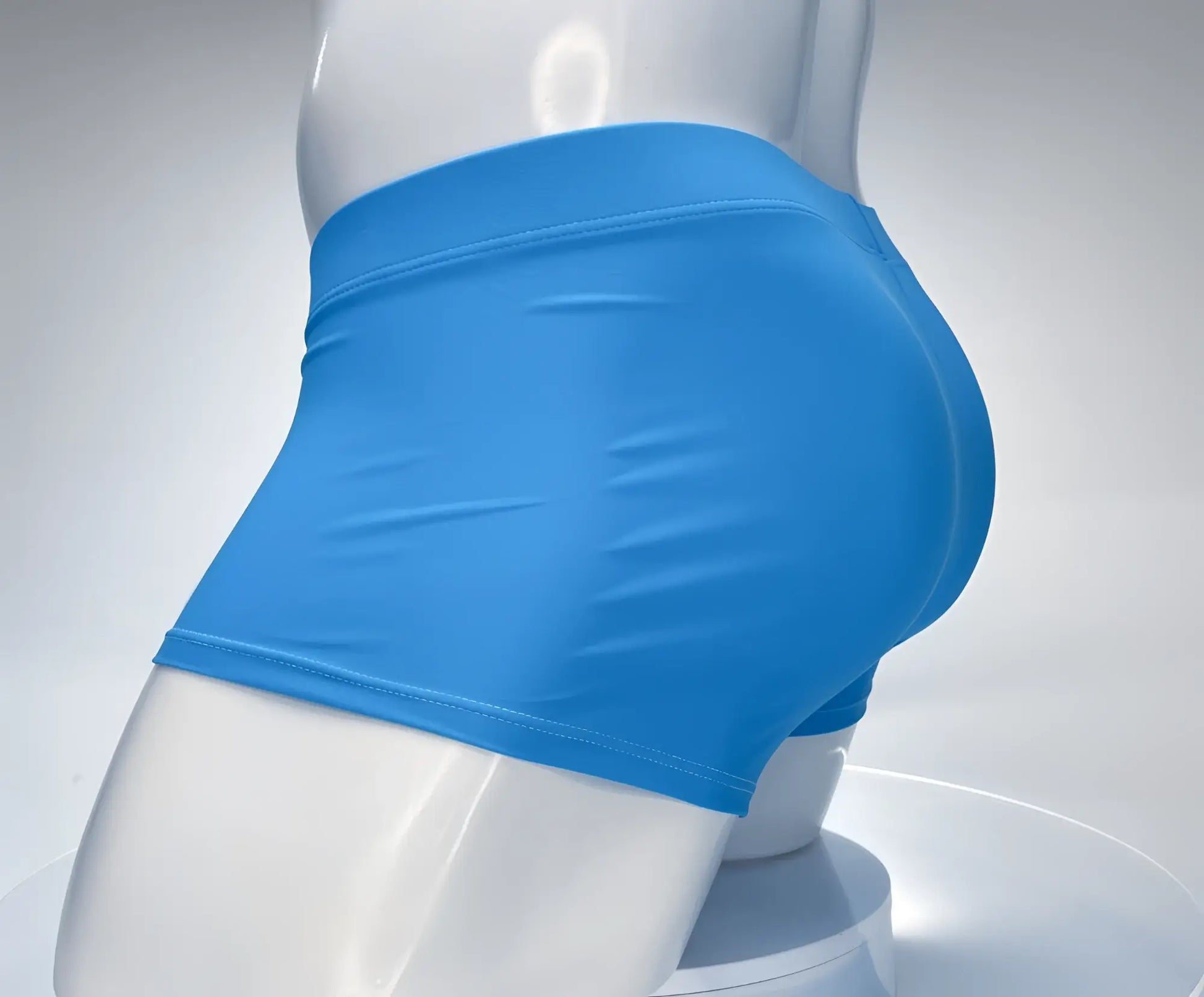 Teal, square-cut swim trunks on a white mannequin, featuring a smooth, form-fitting design and flat-lock stitching.