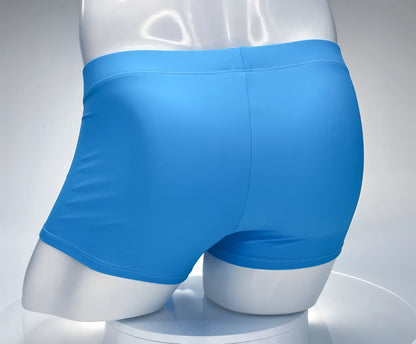 Bright blue smooth-fitting WildmanT Monster Cock swim square cut boxer briefs displayed on a mannequin front view