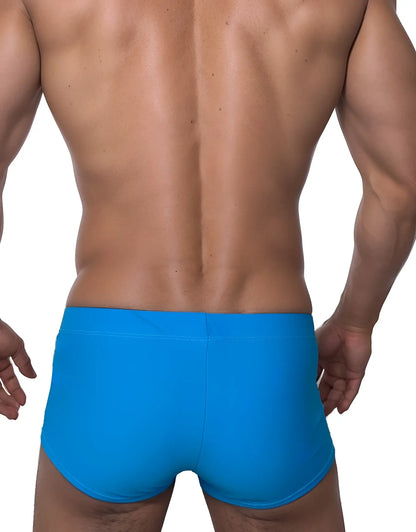 Wildmant monster cock swim square cut swim trunks in bright blue with teal and white accents in a form-fitting style