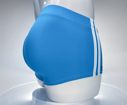 Wildmant monster cock swim square cut bright blue swim trunks with three white stripes displayed on mannequin