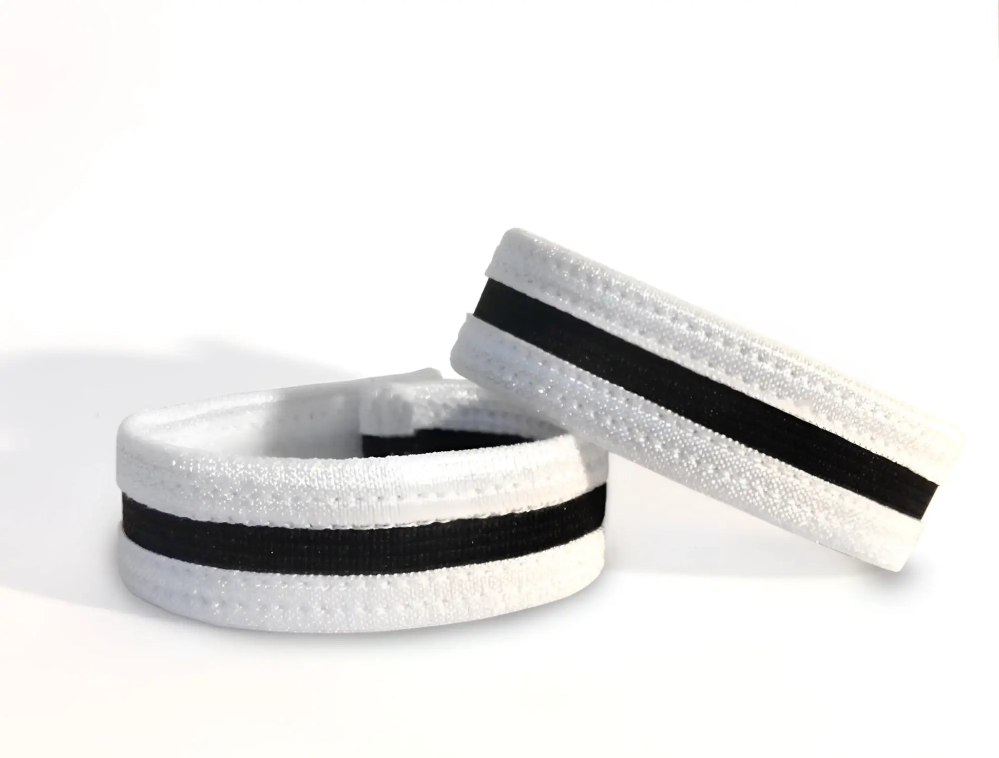 White elastic wristband with black stripe and textured surface from wildmant slim cock ring collection