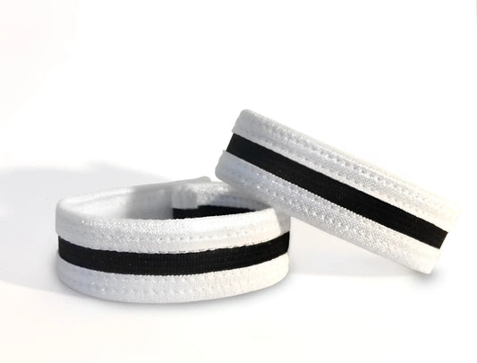 White elastic wristband with black stripe and textured surface from wildmant slim cock ring collection