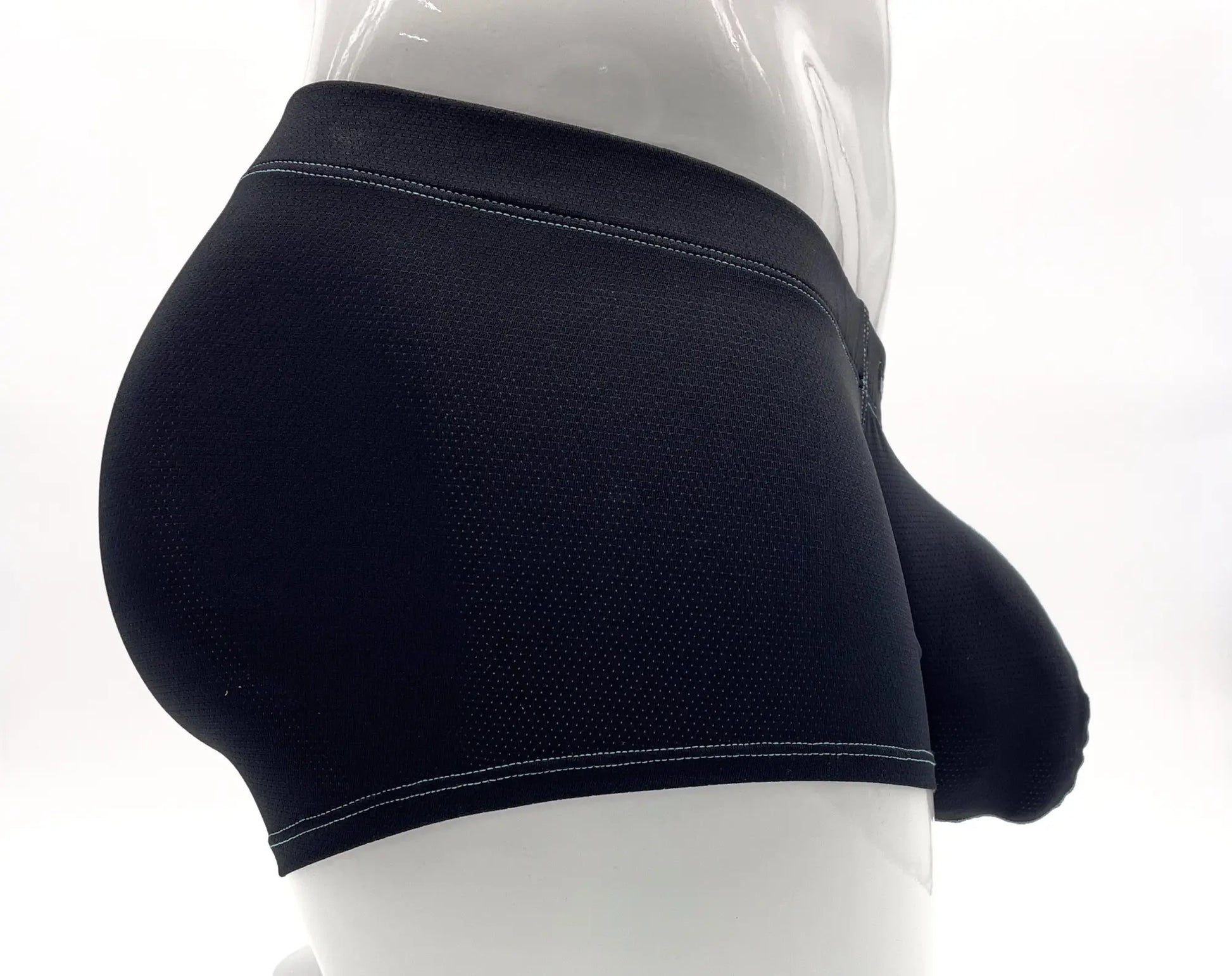 Blue boxer briefs with a textured fabric, a prominent front pouch, and visible light blue stitching on a mannequin.