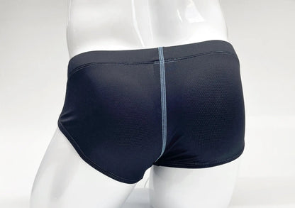 Blue, perforated-fabric brief on a white mannequin, featuring a contrasting light blue vertical center stitch.
