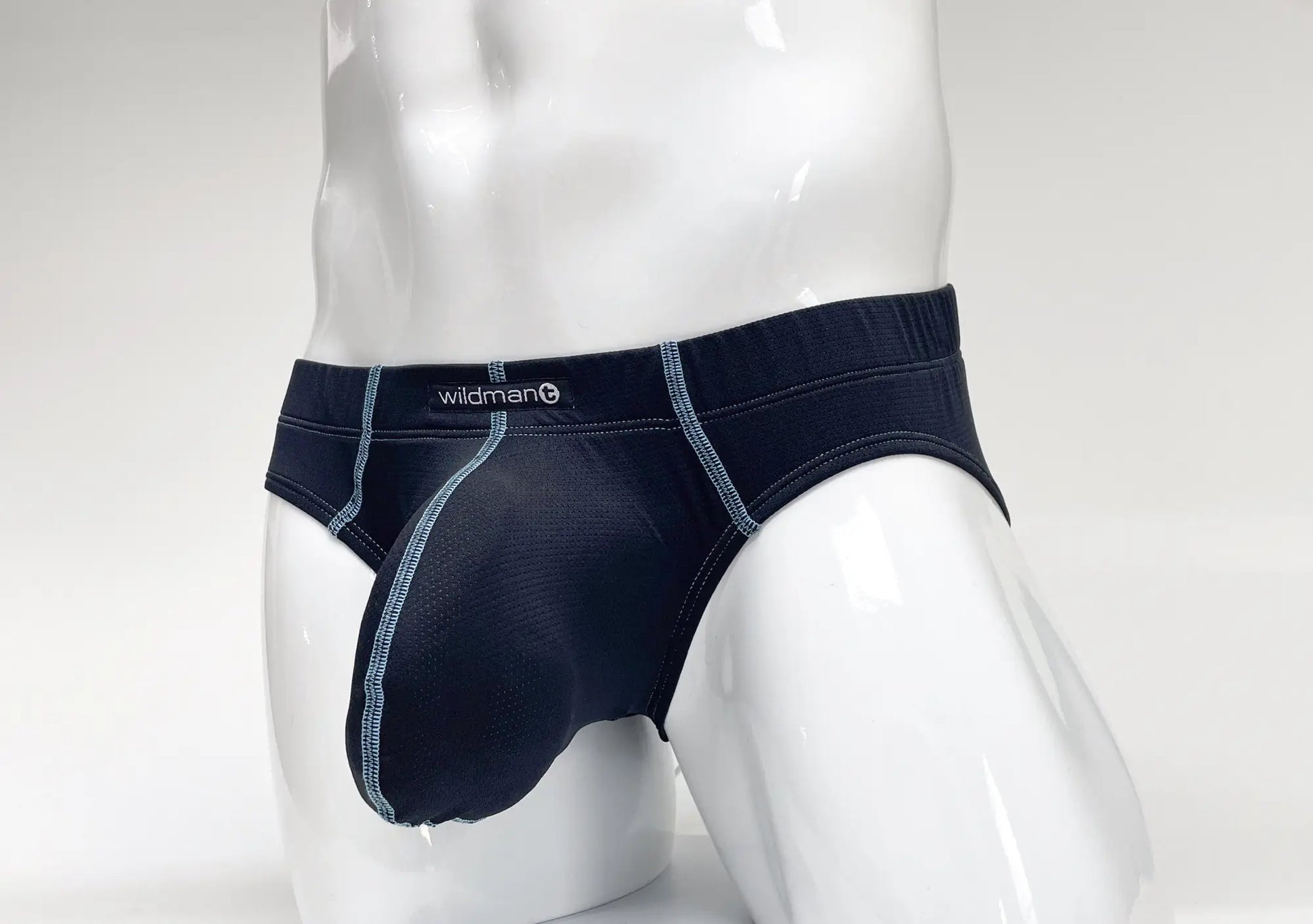 Stitch Big Boy Pouch Brief in navy blue with light blue contrast stitching and a Wildmant logo on a white mannequin.
