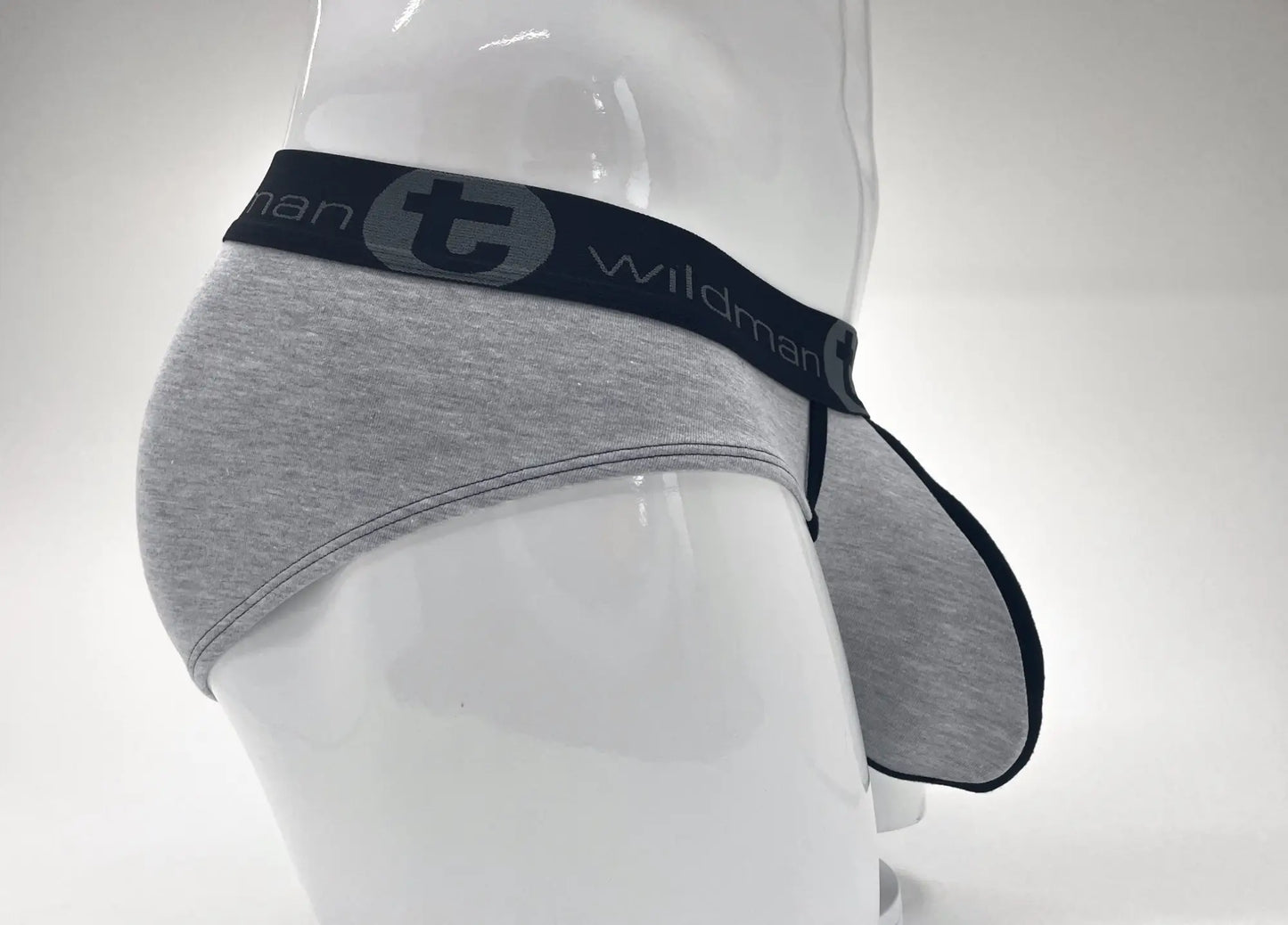 Gray heathered cotton briefs with black elastic waistband featuring wildman brand logo and stylized t emblem