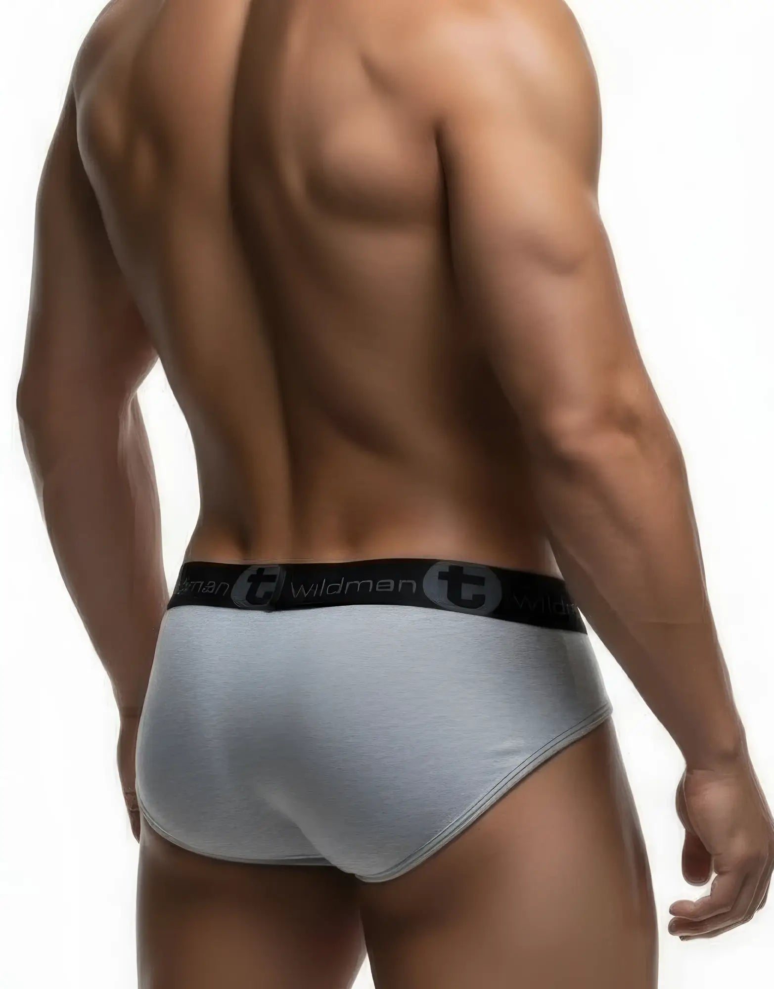 Back view of a muscular man wearing heather gray stretch cotton briefs with a black branded "WildmanT" waistband.