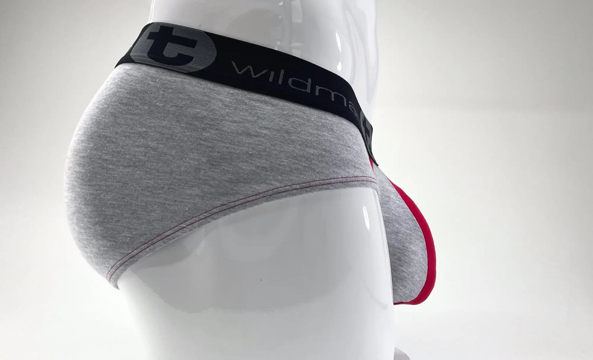 Wildmant stretch cotton big boy pouch brief in gray with red trim and a black waistband featuring the wildman logo