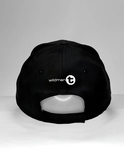 Black wildman t vanity cap its big with white logo and circular emblem on the back side