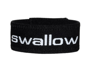 Black elastic cock ring with the word "swallow" embroidered in white text on the front.