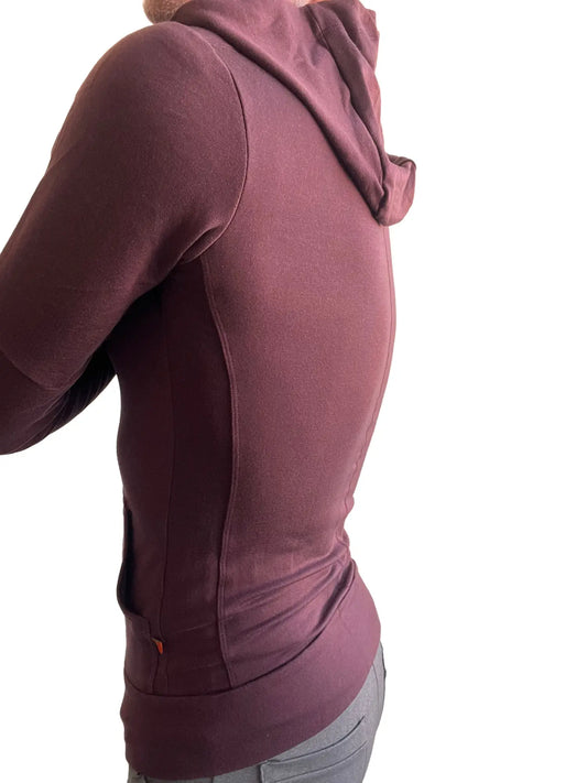 A maroon mid-weight luxury-fleece form-fit crossover yoga track hoodie with soft textured fabric and subtle seam detailing