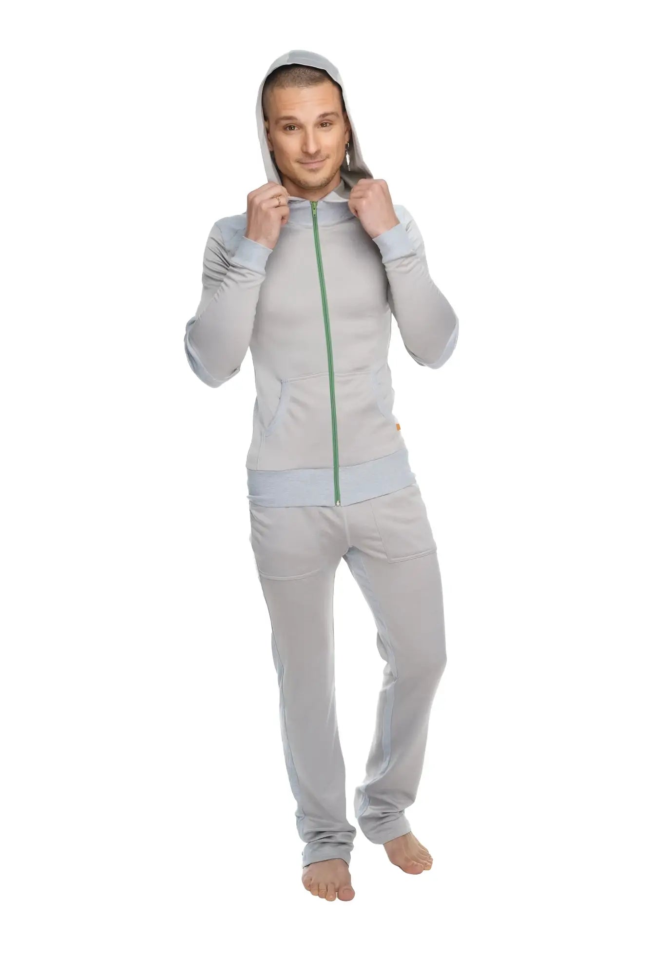 A light gray mid-weight fleece tracksuit with green zipper and hood from the winter collection for performance and lounge