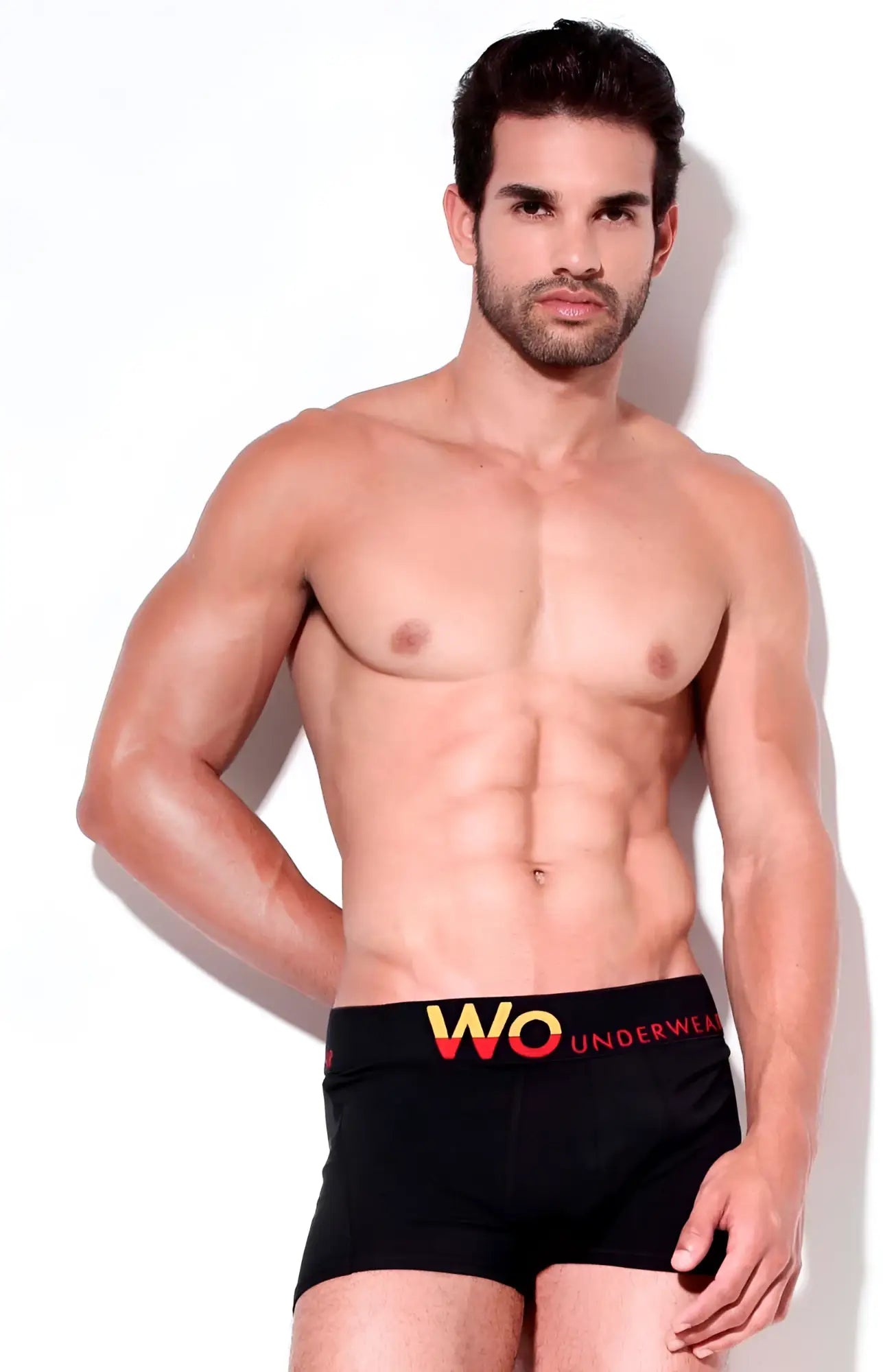 Black men’s boxer briefs size M with bold yellow and red wo underwear logo on black waistband solid fabric