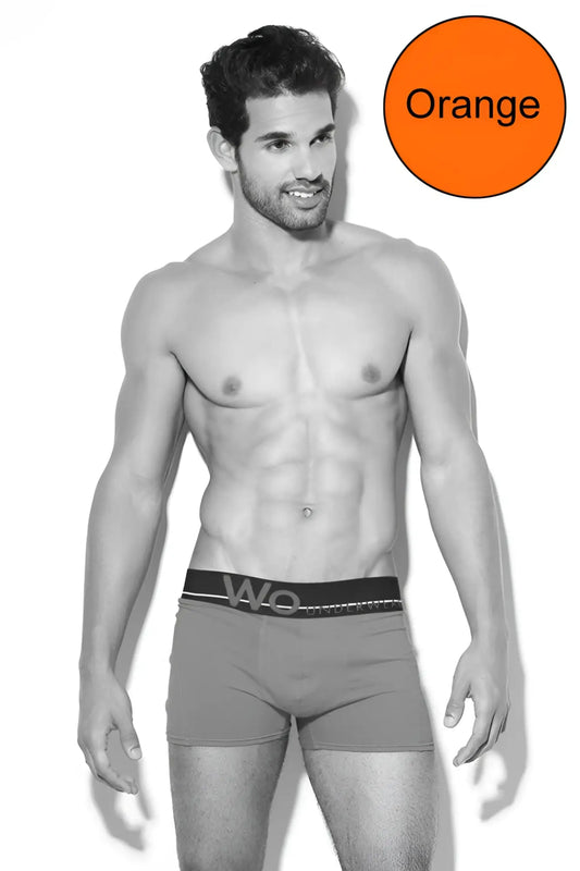 Orange waistband with wo logo on black elastic band of wo underwear solid boxer brief in size s