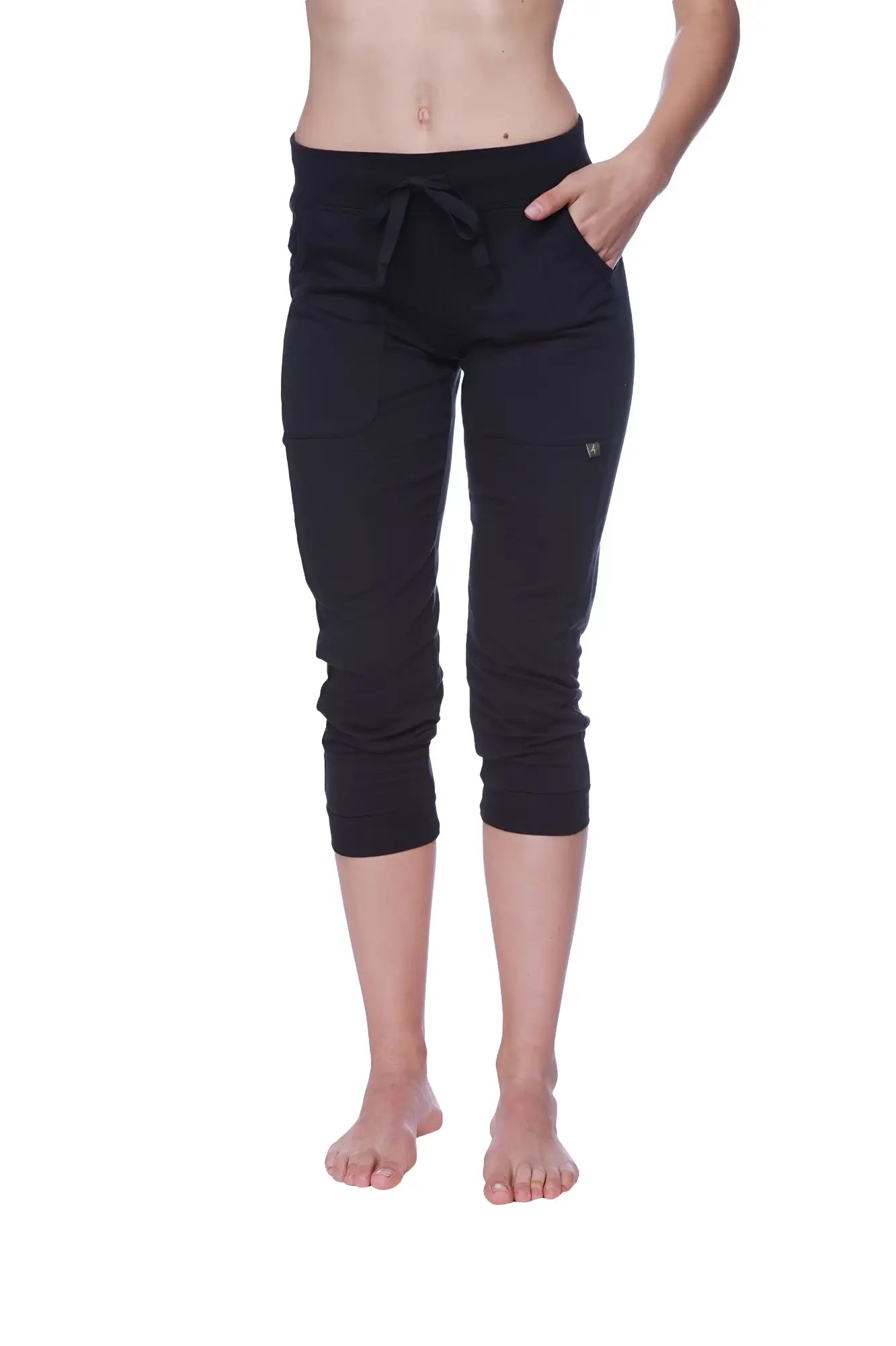 Black capri-length jogger pants with a drawstring waistband and side pockets for women solid black
