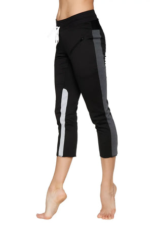 Women’s black capri yoga pants with gray and white side stripes and drawstring waistband for athletic wear