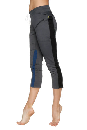 Women’s charcoal gray 4/5 length zipper pocket capri yoga pant with black and blue side panels and drawstring waistband