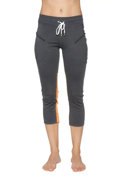 Women’s 4/5 length zipper pocket capri yoga pant in charcoal heathered gray with orange side panels and white drawstring waistband