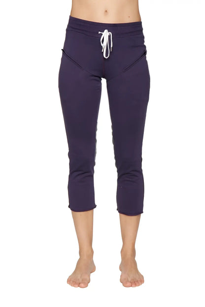 Women’s navy blue capri-length yoga pants with white drawstring waistband and side pockets for activewear