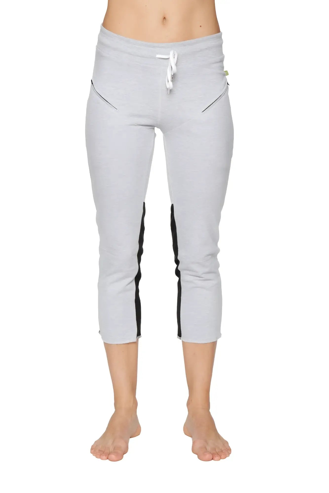 Women’s gray 4/5 length capri yoga pants with black side stripes white drawstring waistband and zipper pockets