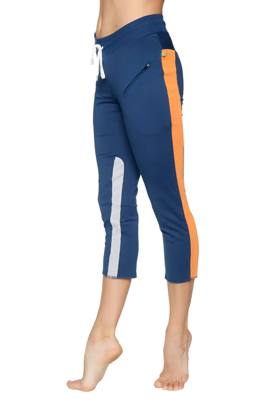 Women’s royal navy blue and orange 4/5 length capri yoga pants with white side stripe and zipper pocket