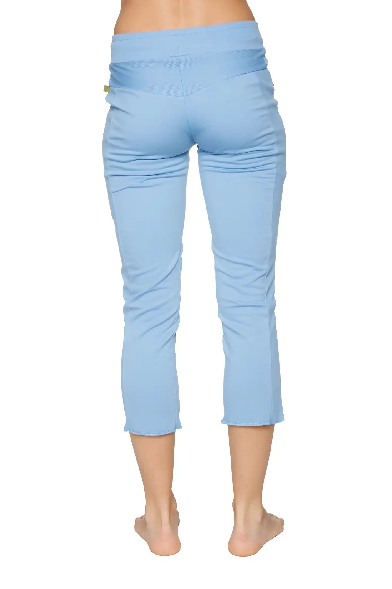 Women’s sky blue high-waisted 4/5 length capri yoga pants with stretchy fabric and subtle side ruching