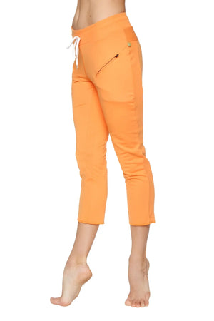 Women’s sun orange 4/5 length capri yoga pants with white drawstring waistband and zippered side pocket