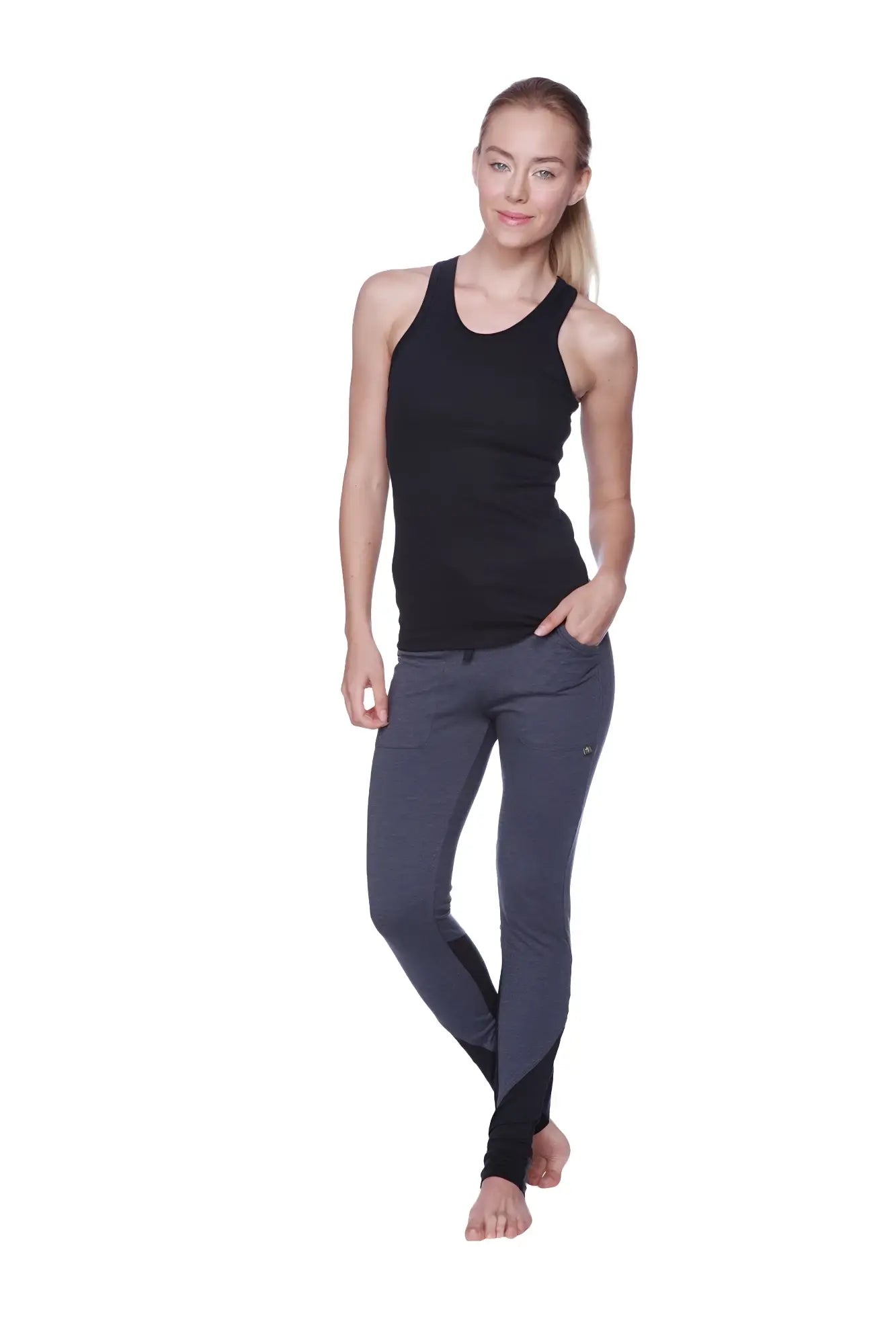 Black and gray sleek form-fitting athletic leggings paired with women’s all-american racerback tank top black