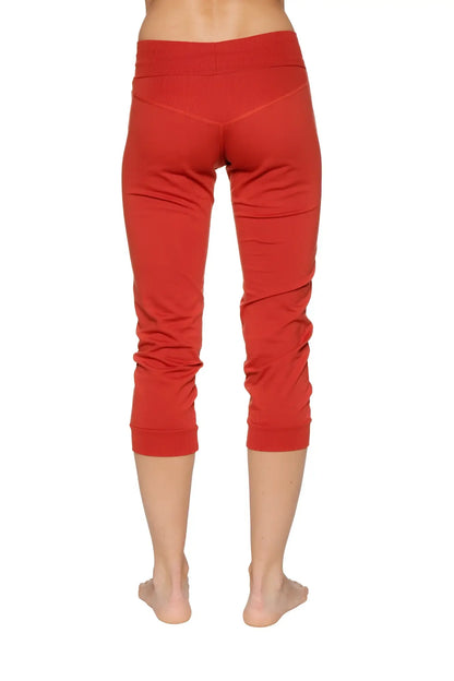 Women’s cinnabar red cuffed jogger yoga pants with stretchy form-fitting fabric and subtle ruching at lower legs
