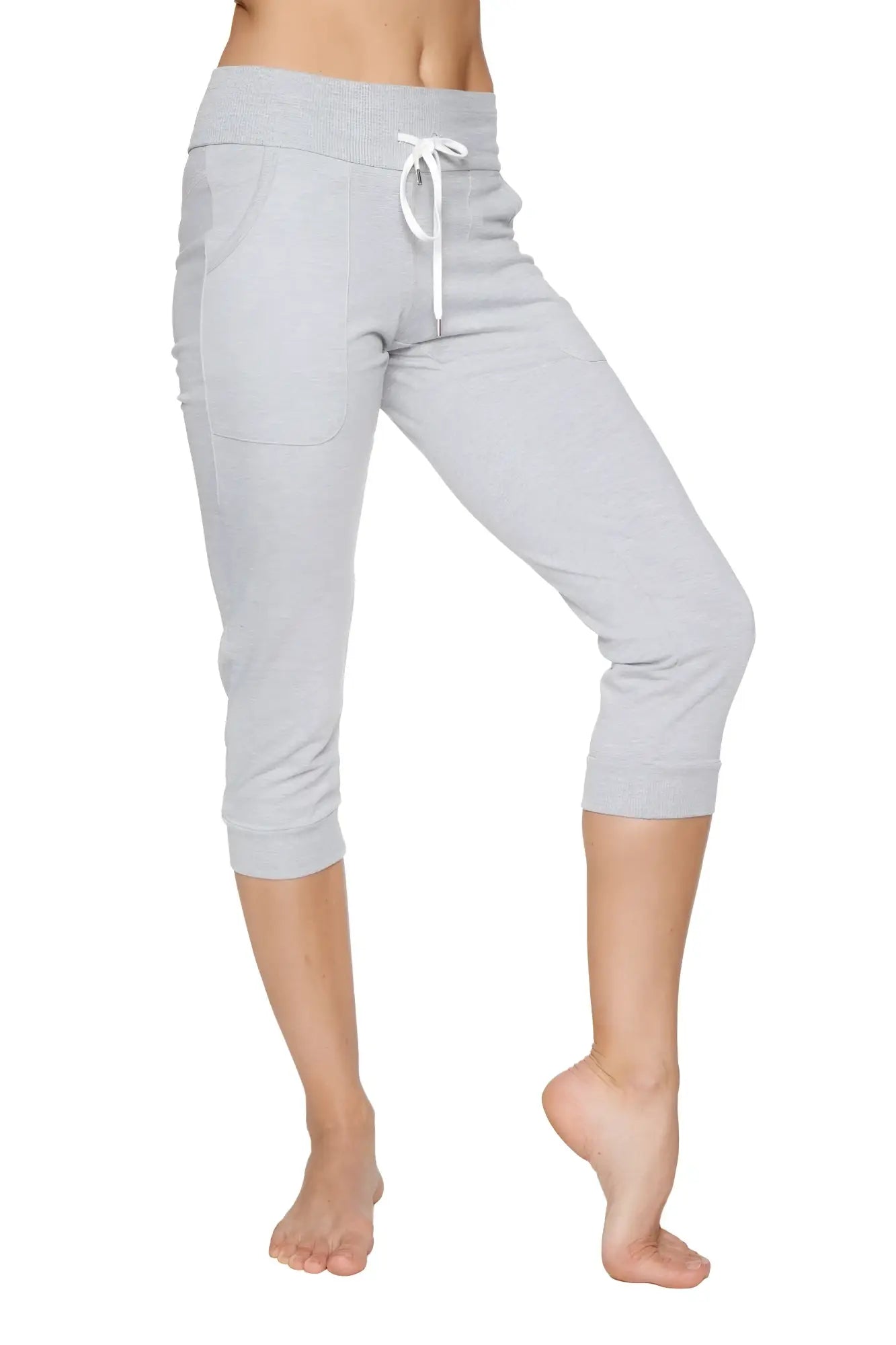 Women’s heather grey cuffed jogger yoga pant with drawstring waistband and side pockets in light gray capri length