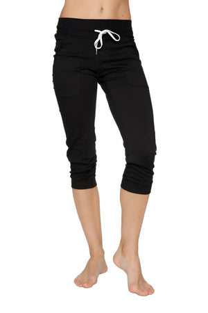 Women’s solid black cuffed jogger yoga pant with white drawstring waistband in capri length for athletic use