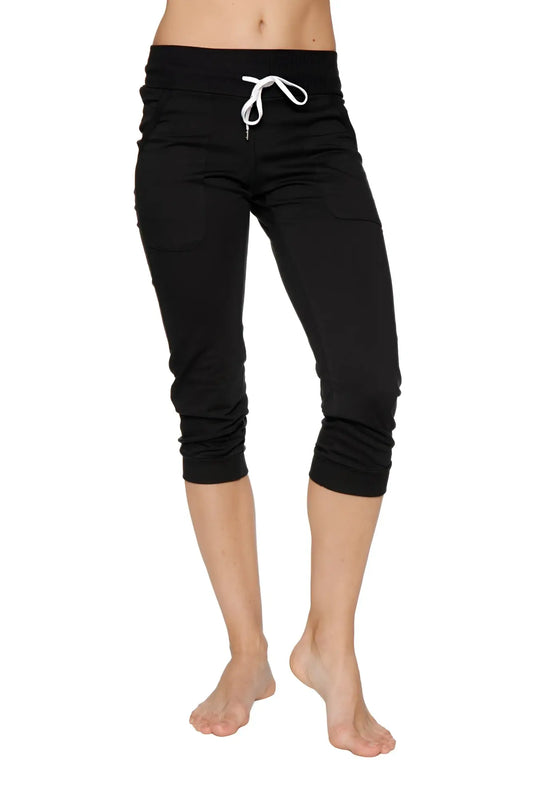 Women’s solid black cuffed jogger yoga pant with white drawstring waistband in capri length for athletic use