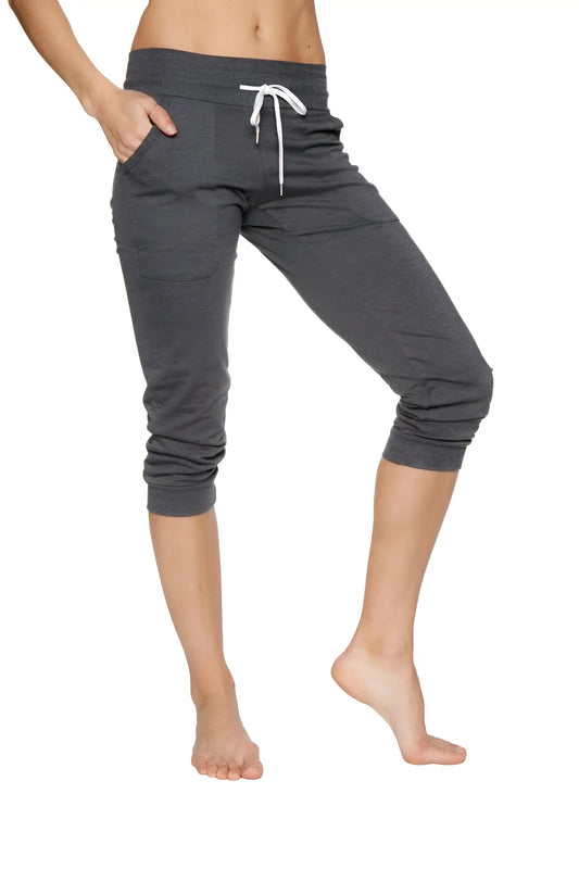 Women’s solid charcoal cuffed jogger yoga pant with dark gray capri length, white drawstring waistband, and elastic cuffs