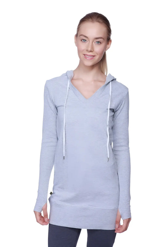 Women’s long body hoodie top in heather grey with charcoal detail featuring a v-neck and white drawstrings