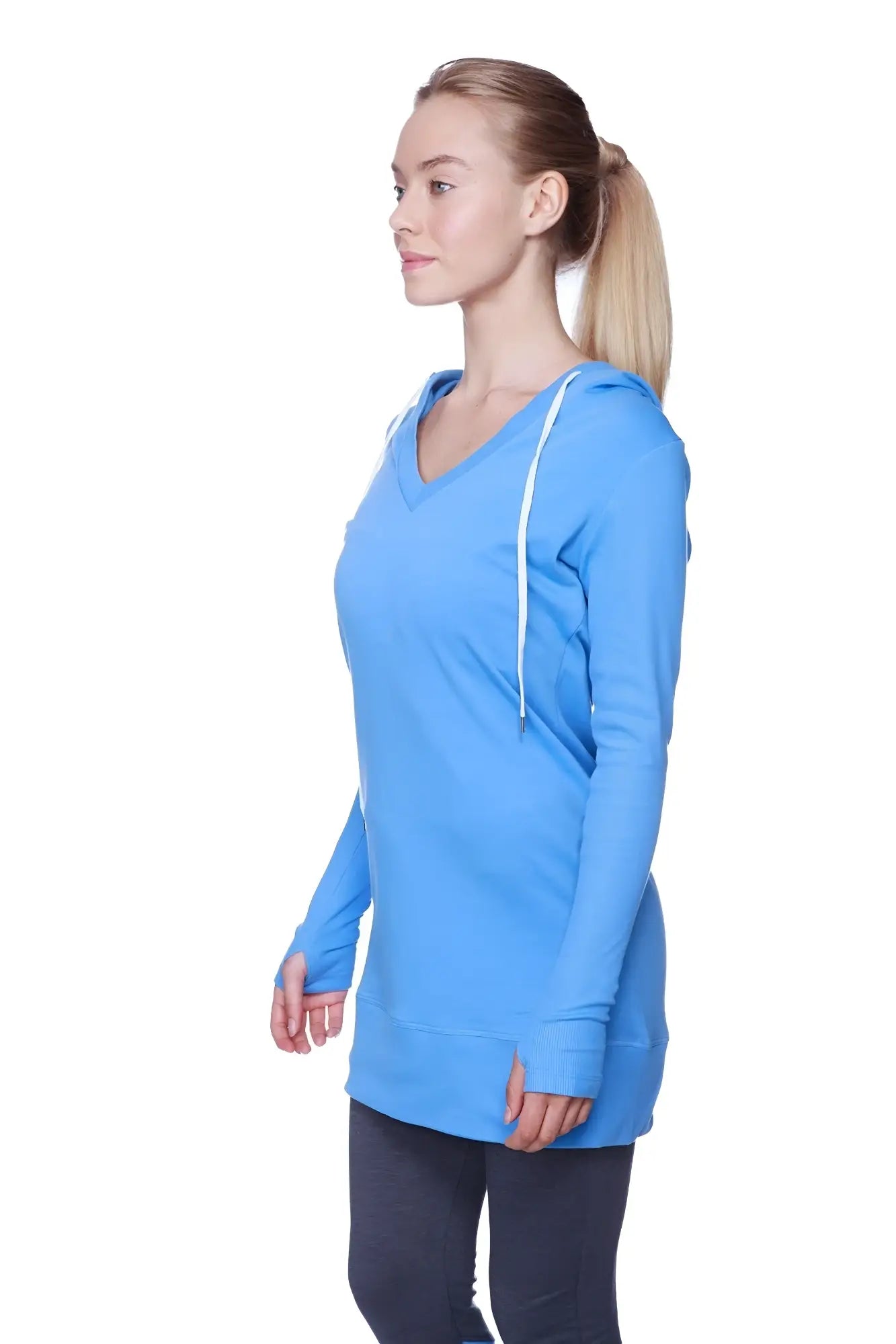 A vibrant ice blue women’s long body hoodie top with royal blue v-neck and white drawstrings in long sleeves