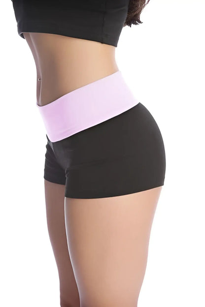 Womens yoga transition shorts in black with a wide light pink elastic waistband for comfortable movement