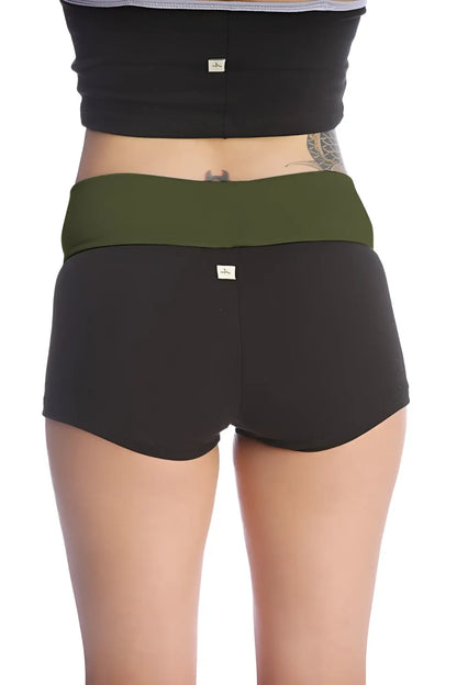 Womens yoga transition short in black with olive green waistband made of soft stretchy fabric with subtle brand tags