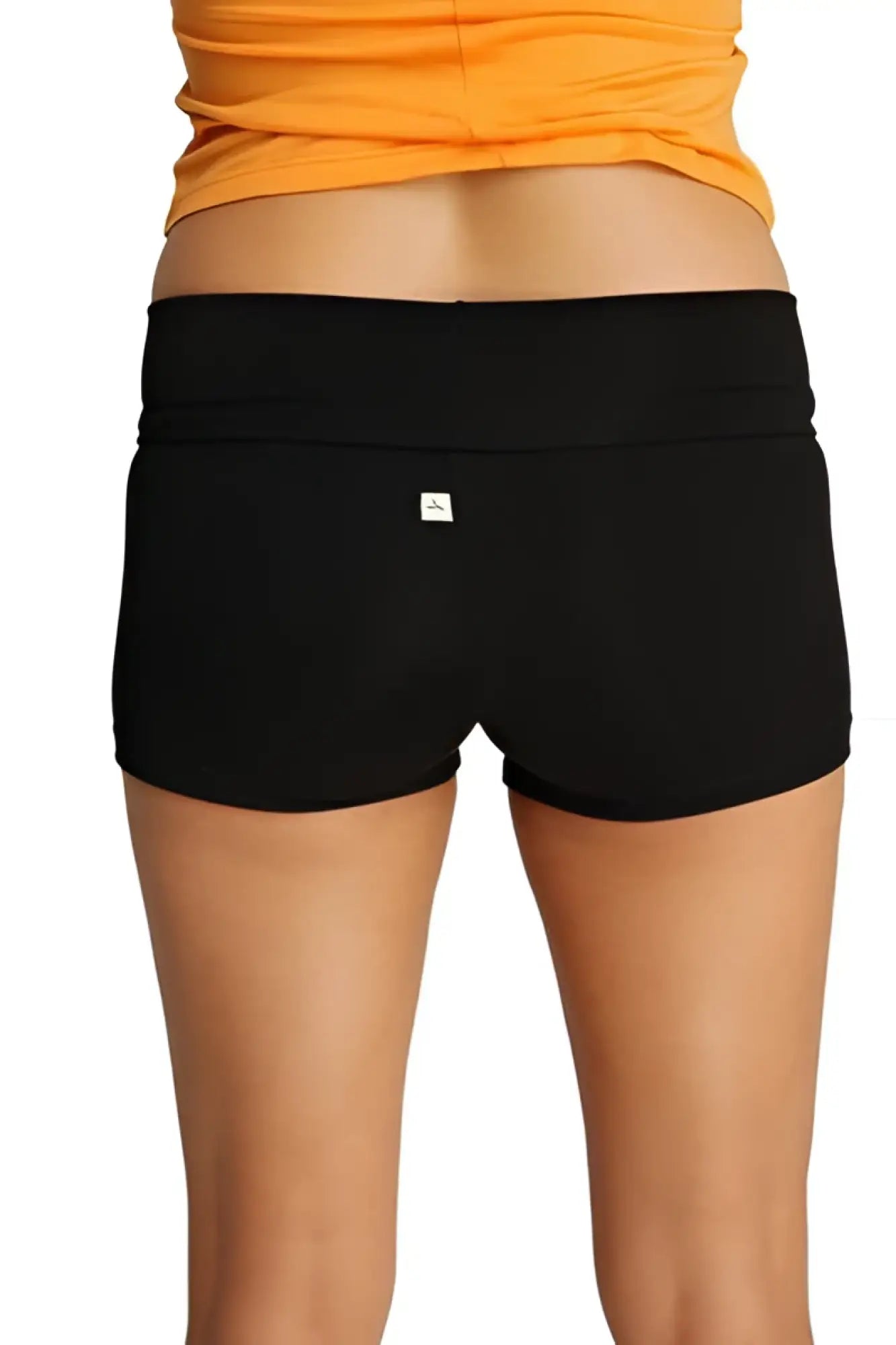 Womens yoga transition short black stretchy fabric with wide waistband and small white logo on the back side