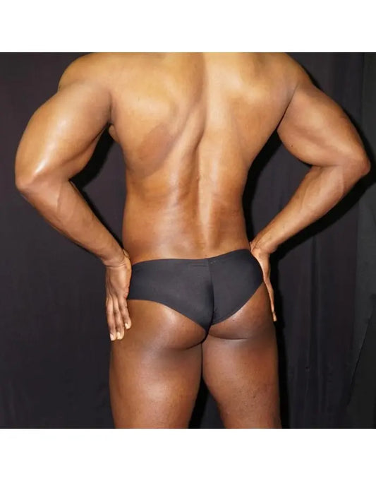 Black boxer underwear by Arroyman featuring a snug fit and smooth fabric shown on a model from the back.