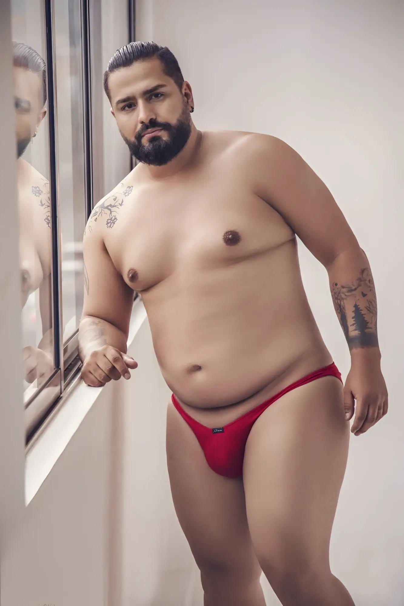 Red men’s Xtremen 91093X microfiber bikini briefs with a small black logo on the left hip
