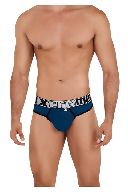 Blue xtreme microfiber briefs in petrol color with white and black logo band visible from the back side