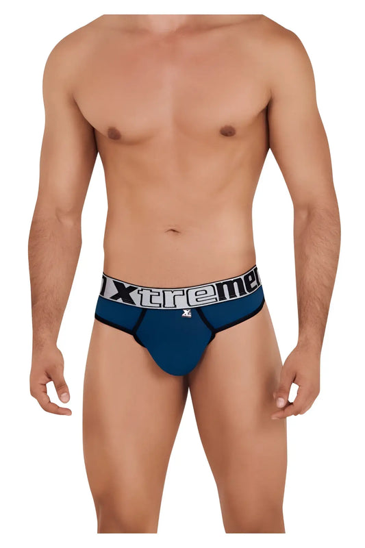 Blue xtreme microfiber briefs in petrol color with white and black logo band visible from the back side
