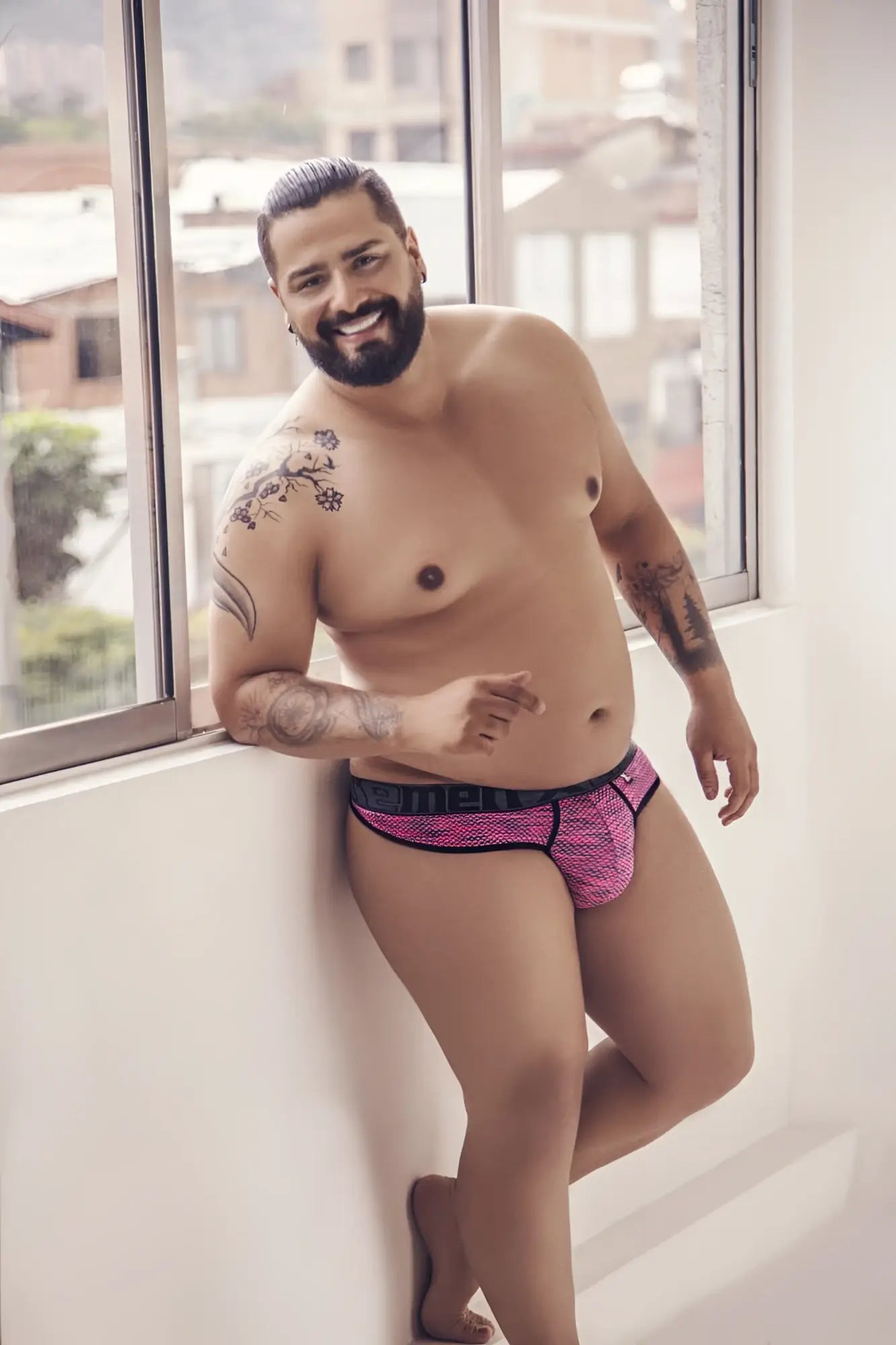 Pink patterned microfiber mesh briefs with black trim from xtremen 91100x featuring breathable fabric
