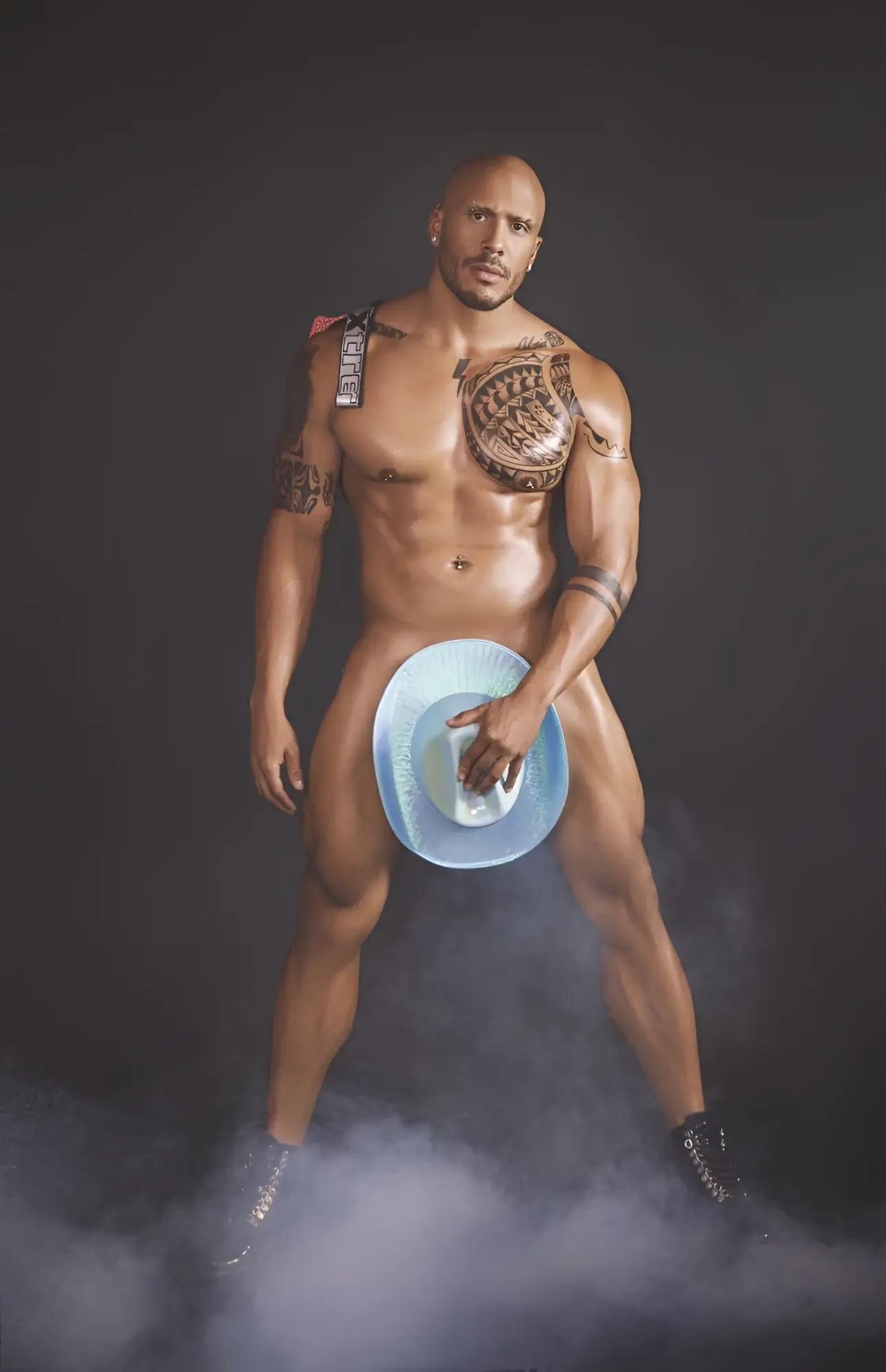 Muscular man holding a blue cowboy hat with white interior wearing xtremen 91128 snake print red jockstrap