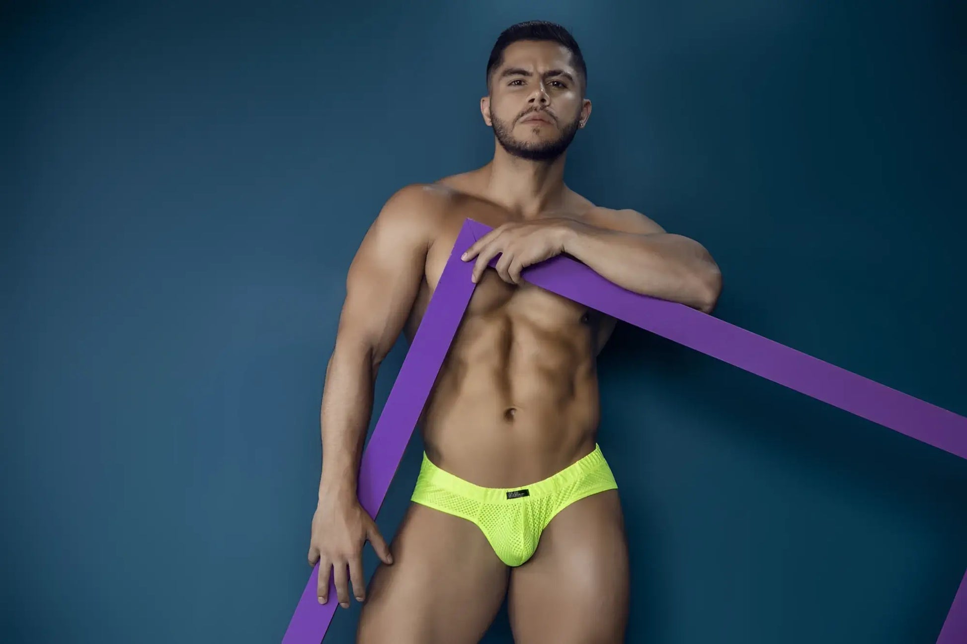Bright neon yellow xtremen 91227 microfiber briefs with mesh fabric and subtle black logo on the front