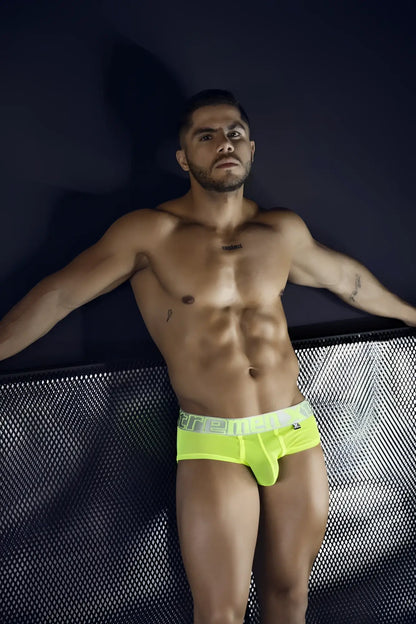 Bright neon yellow microfiber briefs with white elastic waistband and ere branding in black lettering