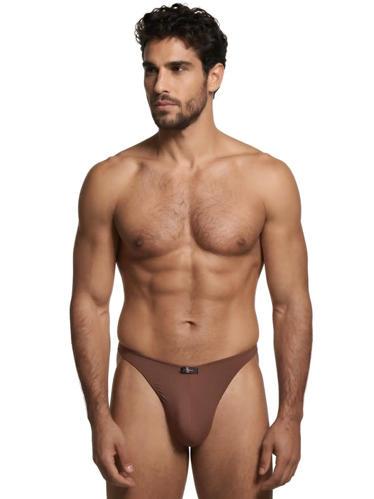 Xtremen brown bikini brief with a smooth, matte finish and a small center logo tag on a muscular male model.